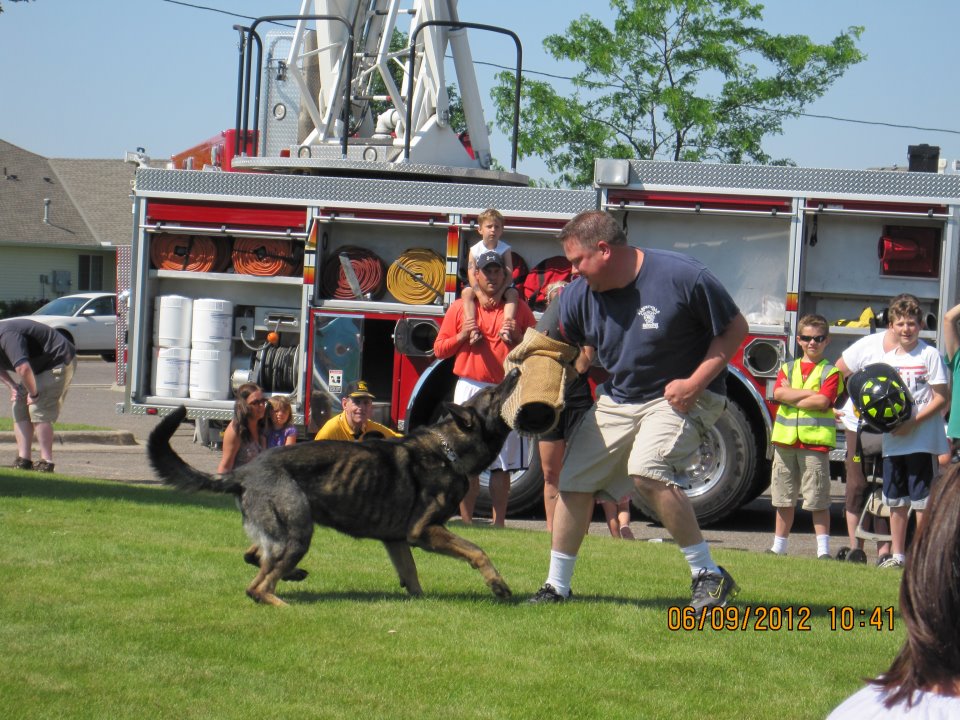 open-house-2012-firefighter-helping-with-K9-demo.JPEG1