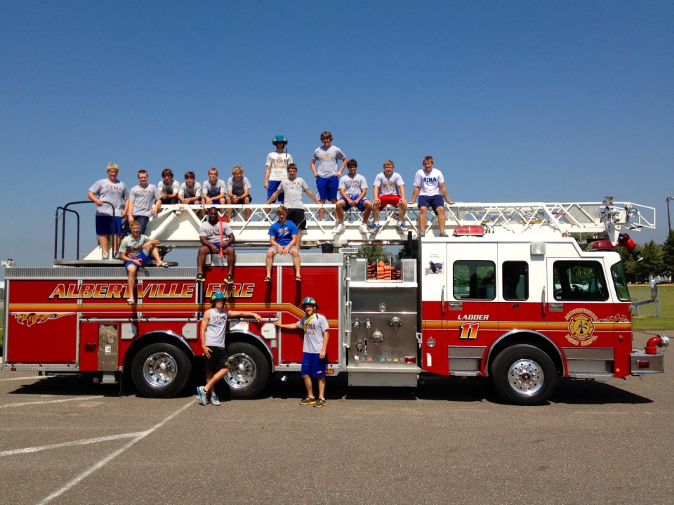 STMA-football-team-on-Ladder11.JPEG